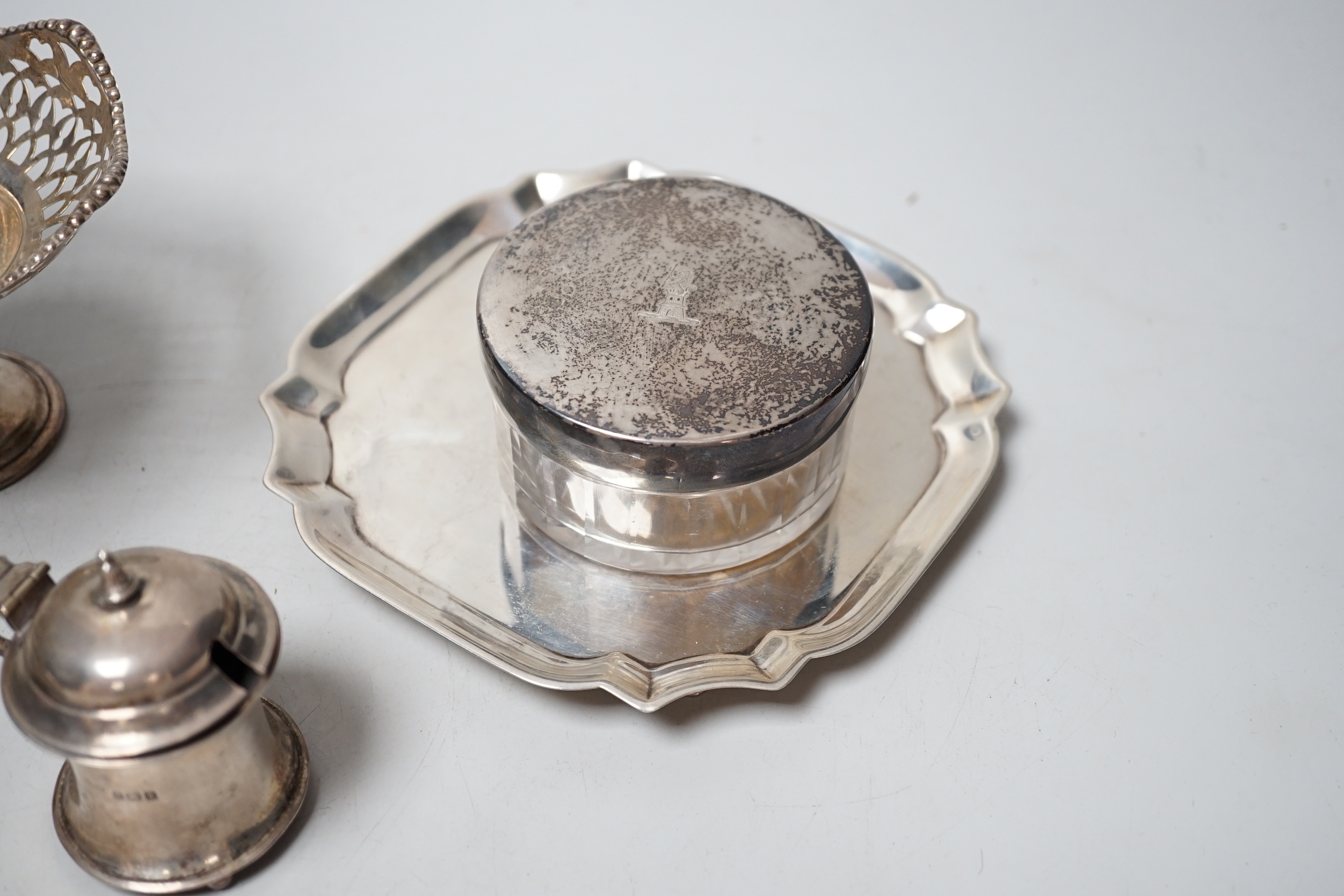 Sundry small silver including a late Victorian silver waiter, Birmingham, 1899, 14.5cm, two silver mounted toilet jars, a silver mustard pot and pair of silver pedestal tazzes.